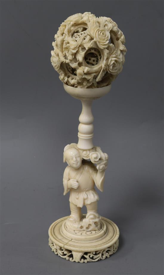 A Chinese ivory concentric ball on stand